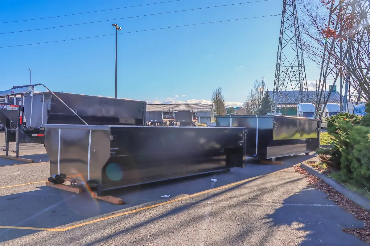 Roll-off dumpster ready for waste disposal at job site for 3 Yard Dumpster Rental in Lawrenceville